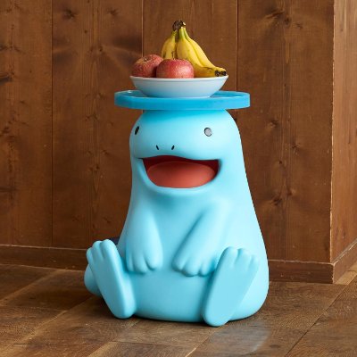 Blue ヌオー mini table figure made of plastic shown with a bowl of fruit on top.