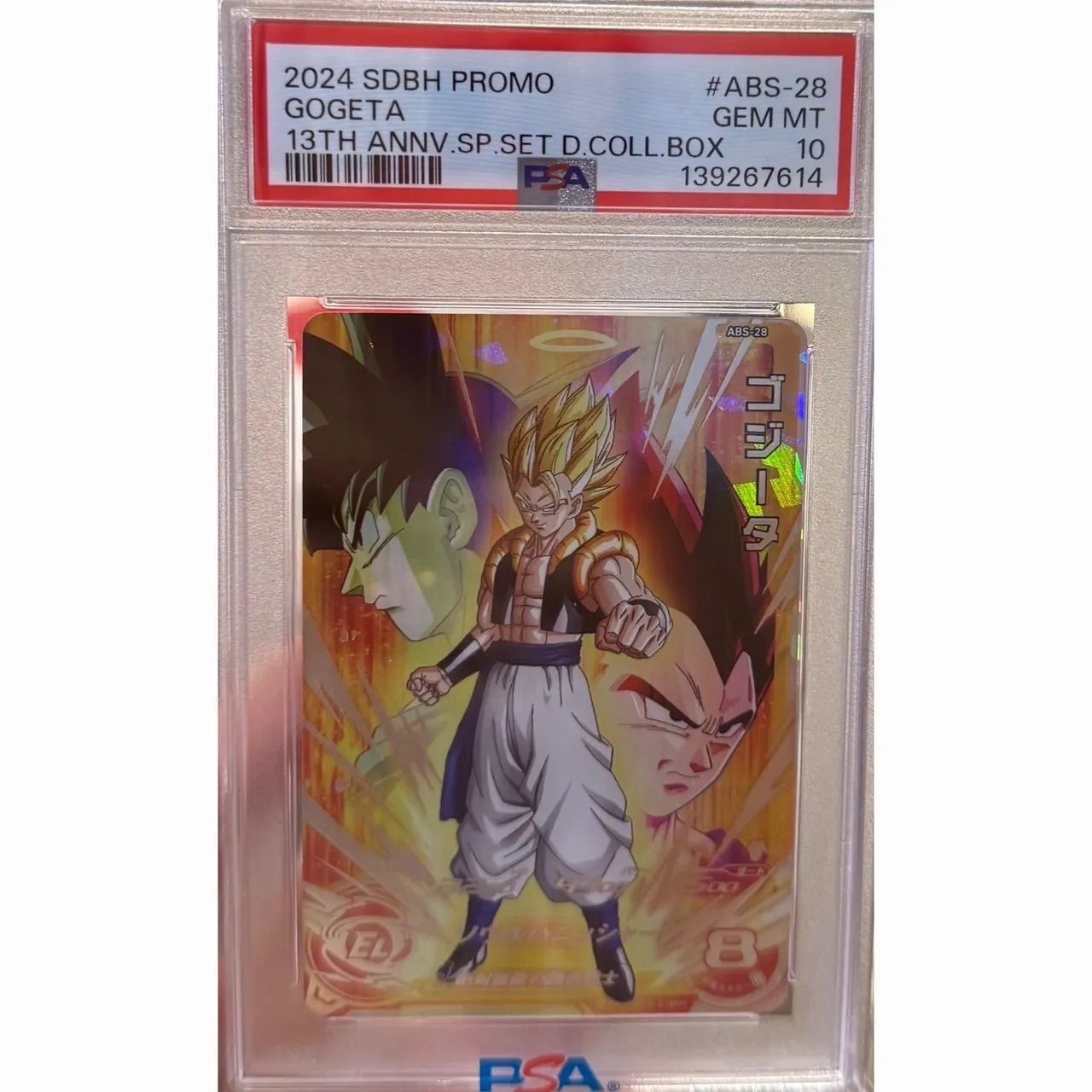 PSA-graded Gogeta trading card in a clear PSA slab with a label showing GEM MT 10 and ABS-28.
