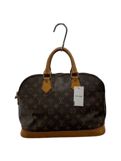 Brown monogram canvas bag with leather trim and top handles hanging from a hook with a white tag attached.