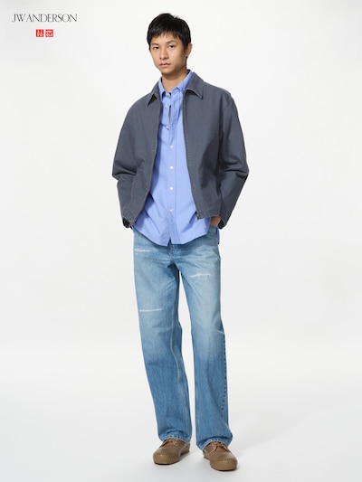 Male model wearing the straight selvedge men's jeans in light blue, shown full length.